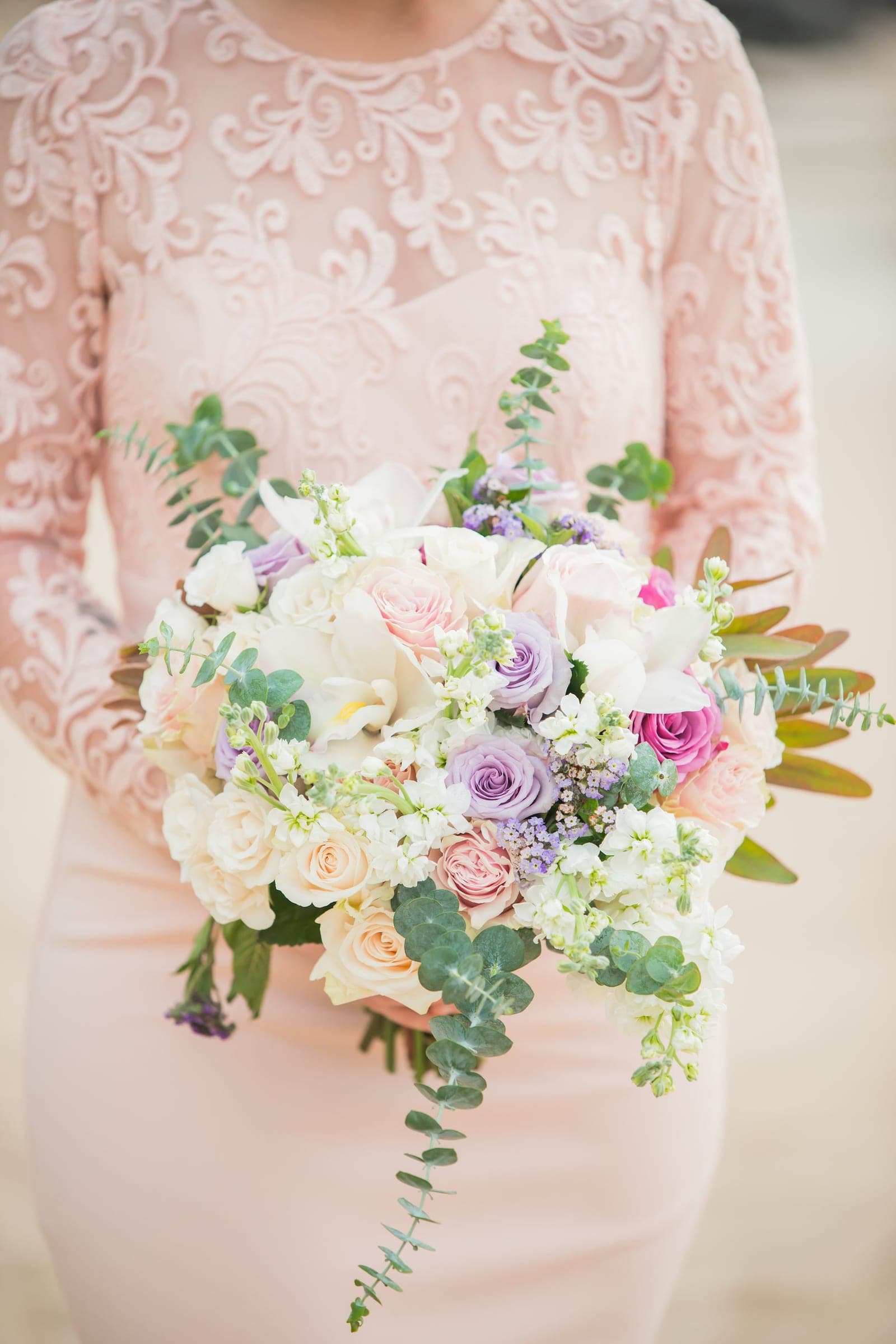 Bride holding her bouquet outdoors