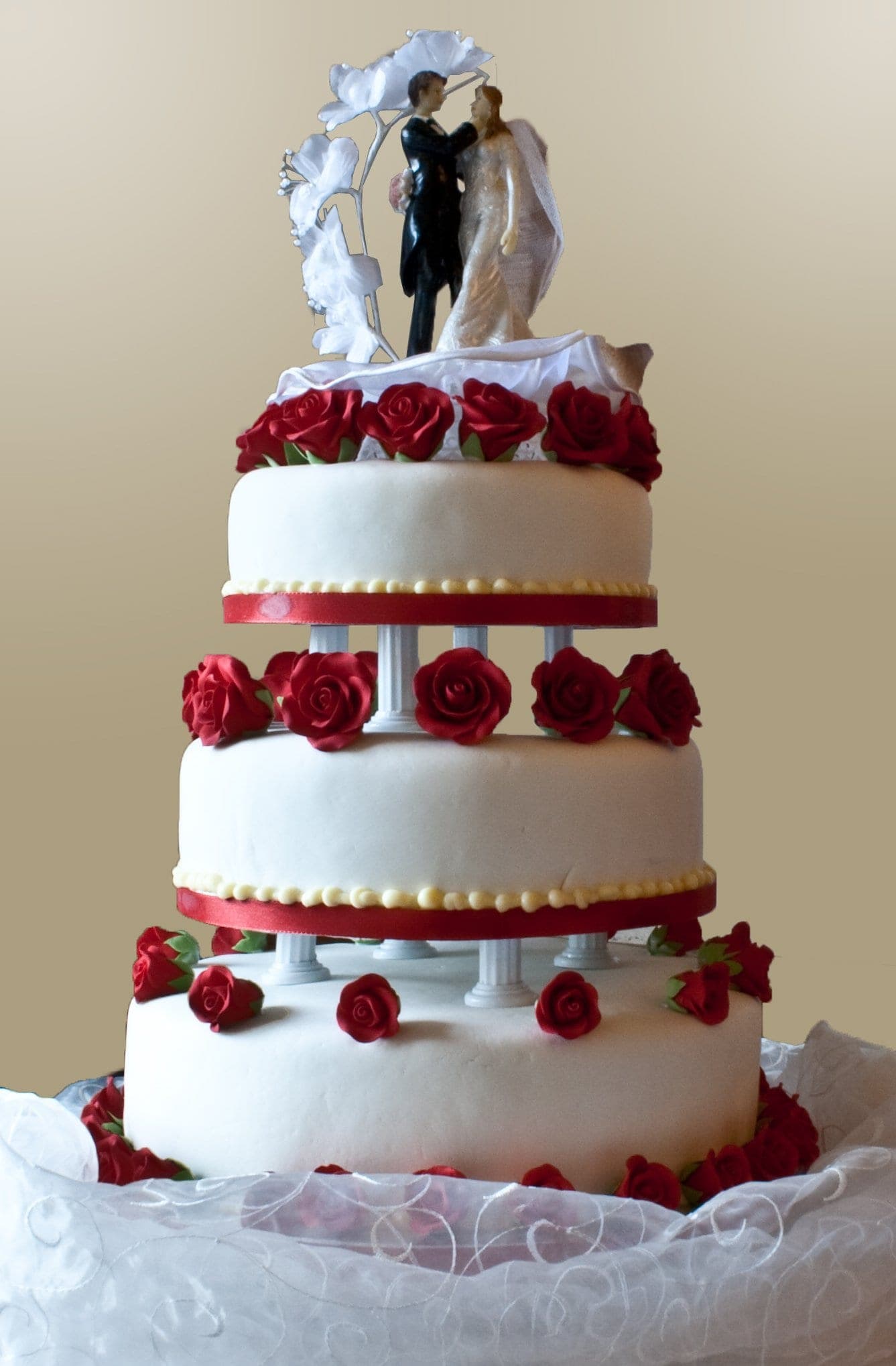 Tiered wedding cake with rose detailing